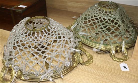 A pair of ormolu and glass ceiling lights length 47cm